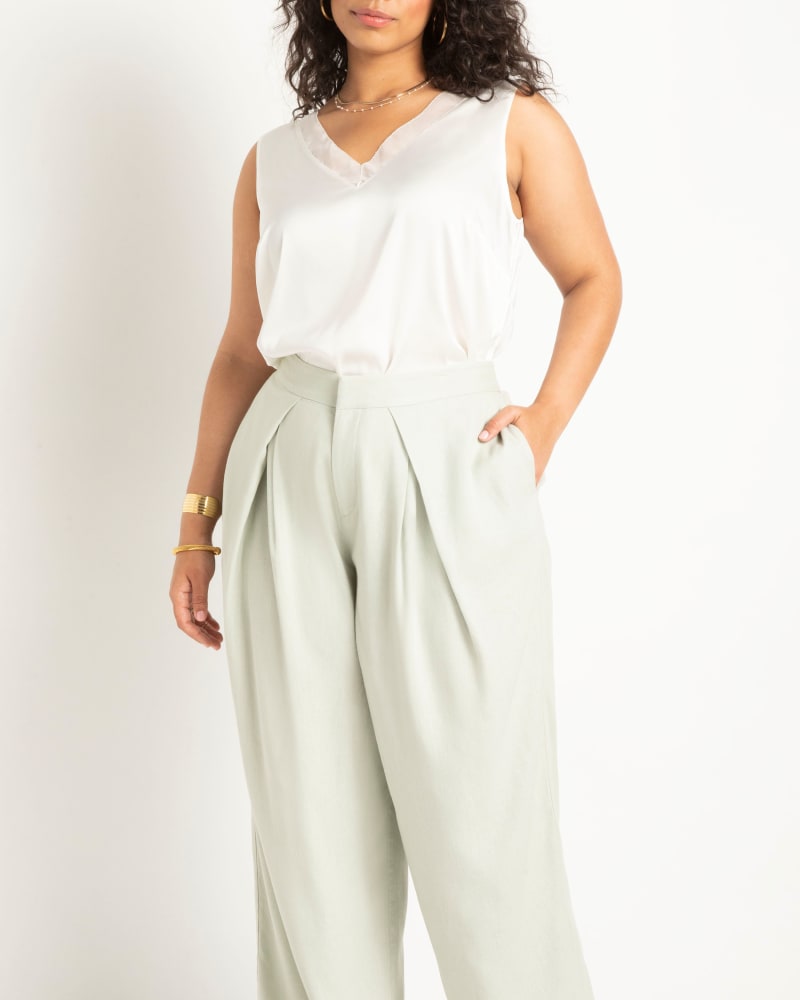 Front of a model wearing a size 28 V Neck Satin And Chiffon Tank in Cream White by ELOQUII. | dia_product_style_image_id:295392